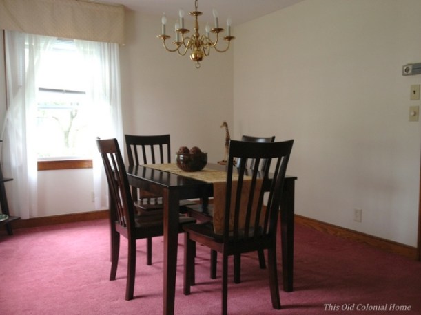 Colonial house dining room with carpet before 