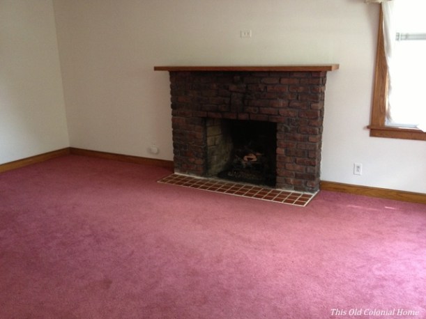 Colonial house living room with fireplace before