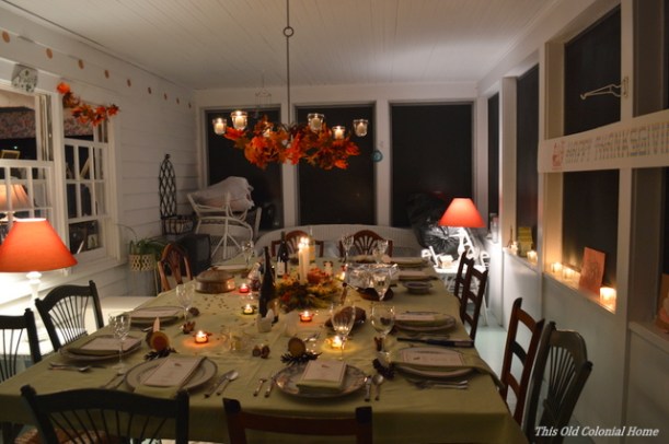 Cozy, candlelit Thanksgiving table 