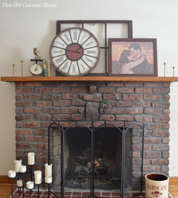 Brick fireplace with rustic mantel decor