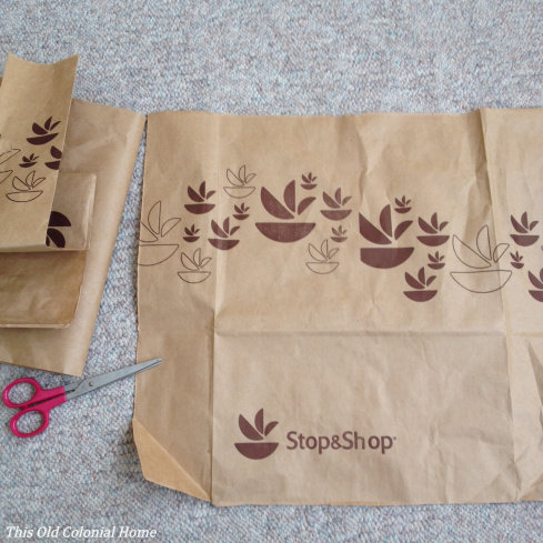 Cut paper bag to fit around frame backing