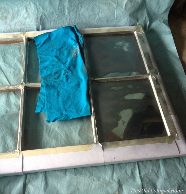 Spray light layers of paint on glass 