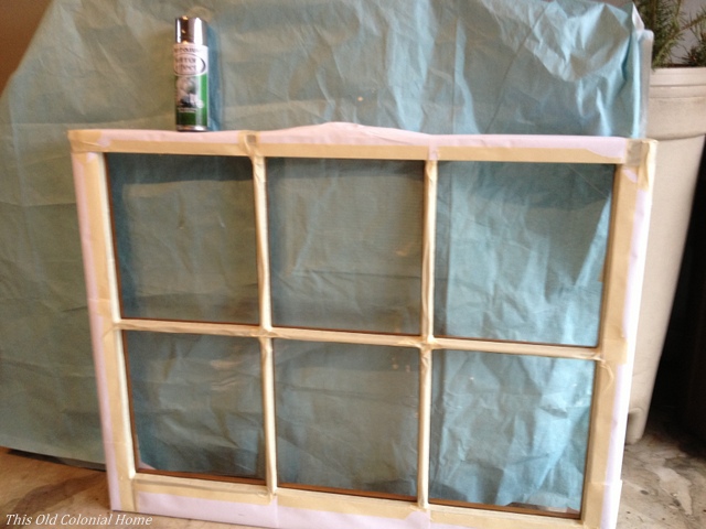 Taped off window pane for spray painting