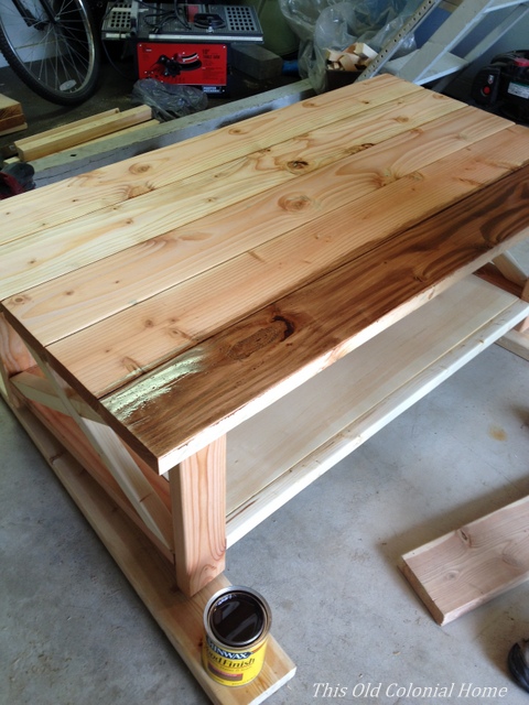 Applying the first coat of stain