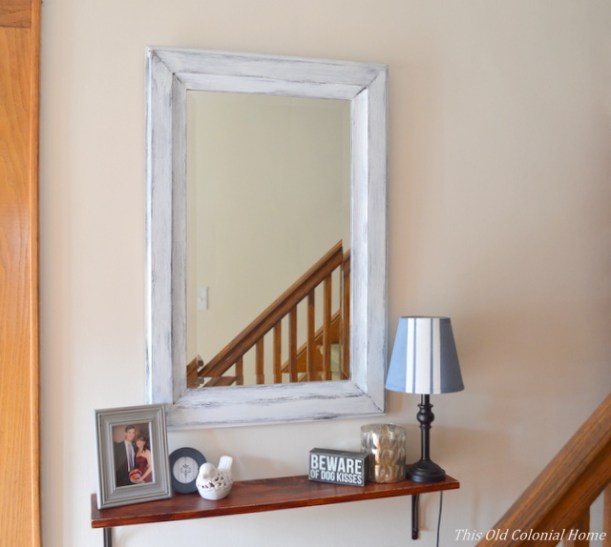 Distressed shelf and mirror in entryway