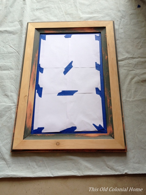 sanding a wood frame mirror
