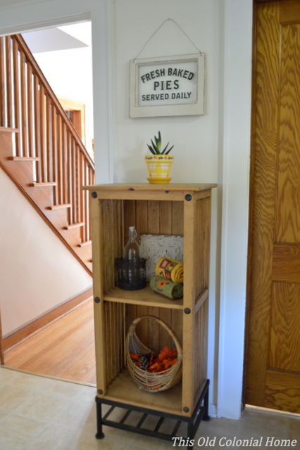 Wooden bookcase with fall decor 