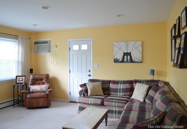 Yellow family room with sectional 