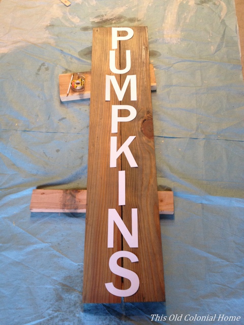 Cut out letters laid out on wood