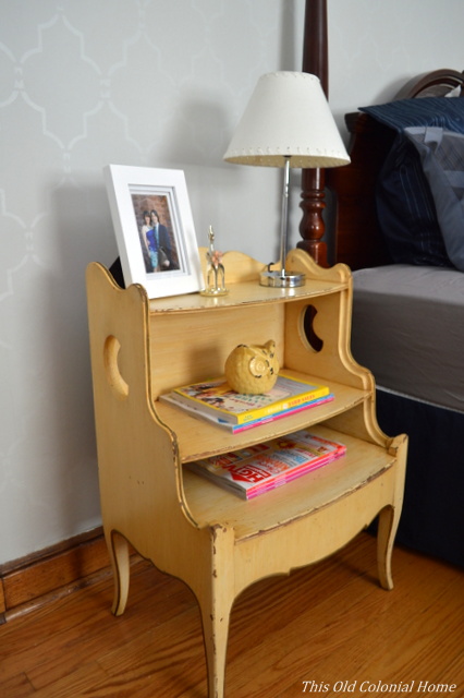 Distressed nightstand with crescent cutouts