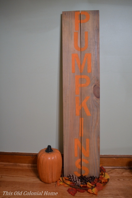 Wood sign with orange pumpkin letters 