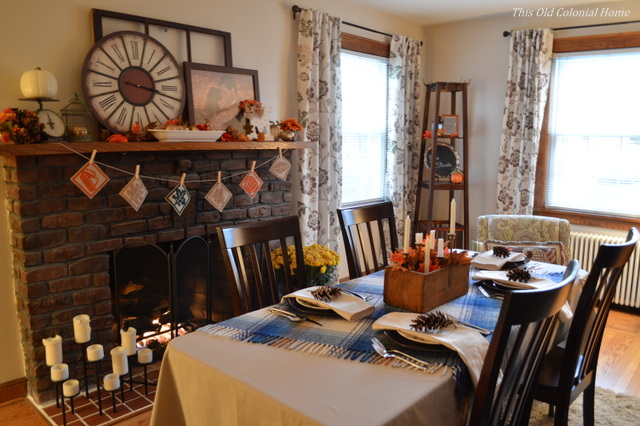 Thanksgiving table set up in living room with fireplace 