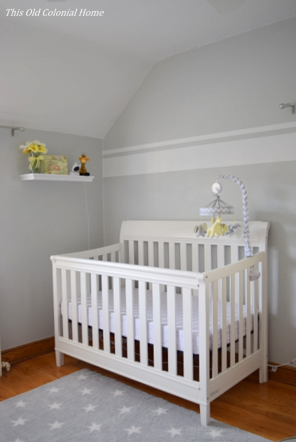 White crib in gray nursery