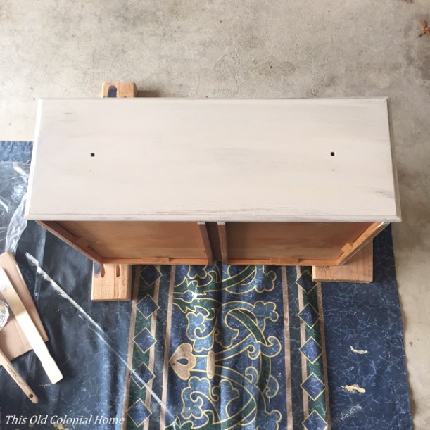 Dresser drawer with one coat of paint 
